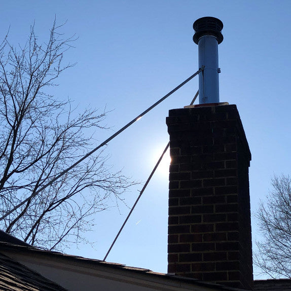 What can i put in the top of my chimney to get this flue pipe centered in  the block? : r/masonry